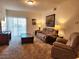 Living room with reclining furniture and sliding glass door at 3550 Bay Sands Dr # 2088, Laughlin, NV 89029