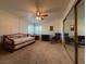 Bright bedroom with a daybed, ceiling fan, and large mirror at 3761 Desert Marina Dr # 81, Laughlin, NV 89029