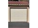 Attached garage with white overhead door at 3761 Desert Marina Dr # 81, Laughlin, NV 89029