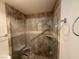 Walk-in shower with grab bars and tiled walls at 3761 Desert Marina Dr # 81, Laughlin, NV 89029