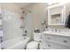 Updated bathroom with white vanity and mosaic tile at 4428 Thicket Ave, North Las Vegas, NV 89031