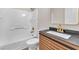 Bright bathroom featuring tiled tub and shower combo, modern vanity with sink, and gold hardware at 4536 Rolls Royce Rd, North Las Vegas, NV 89031