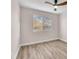Bright bedroom with hardwood flooring, neutral walls, ceiling fan and windows offering a pleasant view at 4536 Rolls Royce Rd, North Las Vegas, NV 89031