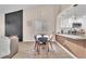 Open concept space with dining area seamlessly connected to the living room and kitchen at 4536 Rolls Royce Rd, North Las Vegas, NV 89031