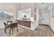 Well-lit dining room with an open concept design and views into the kitchen at 4536 Rolls Royce Rd, North Las Vegas, NV 89031