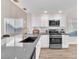 Well-lit kitchen featuring modern appliances, stone countertops, and a stylish faucet at 4536 Rolls Royce Rd, North Las Vegas, NV 89031
