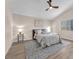 Cozy main bedroom with a ceiling fan and ample natural light at 4536 Rolls Royce Rd, North Las Vegas, NV 89031