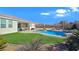 Inviting backyard oasis with a sparkling pool and patio area at 4601 Peppertree St, Pahrump, NV 89061