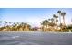 Street view of the entrance to Granada Hills community with palm trees at 4607 El Camino Cabos Dr, Las Vegas, NV 89147