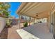 Covered patio with ceiling fan and flagstone flooring at 4607 El Camino Cabos Dr, Las Vegas, NV 89147