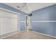 Bedroom with mirrored closet doors and ceiling fan at 4613 Painted Cliffs Dr, Las Vegas, NV 89108