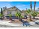 House exterior with landscaped yard and palm trees at 4613 Painted Cliffs Dr, Las Vegas, NV 89108