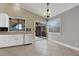 Kitchen with white cabinets and tile floors at 4613 Painted Cliffs Dr, Las Vegas, NV 89108