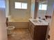 Bathroom features a bathtub, sink, and toilet at 4980 W Weddle Way, Moapa, NV 89025