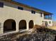 Two story home with covered patio, arched entryways, and a large yard at 4980 W Weddle Way, Moapa, NV 89025