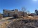 Single-story home with a large yard and needs some TLC at 4980 W Weddle Way, Moapa, NV 89025