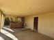 Covered patio with hot tub and access to the home at 4980 W Weddle Way, Moapa, NV 89025
