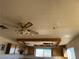 Kitchen with wood cabinets and ceiling fan at 4980 W Weddle Way, Moapa, NV 89025