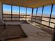 Covered porch with mountain views; needs some repair and maintenance at 4980 W Weddle Way, Moapa, NV 89025