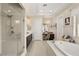 Elegant bathroom with soaking tub, walk-in shower, and double vanity at 7670 Frittata Ave, Las Vegas, NV 89113