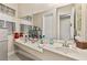 Vanity with a large mirror and a vessel sink at 7670 Frittata Ave, Las Vegas, NV 89113