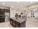 Island kitchen with granite countertops and stainless steel appliances at 7670 Frittata Ave, Las Vegas, NV 89113
