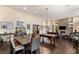Spacious living room with a stone fireplace, pool table, and hardwood floors at 7670 Frittata Ave, Las Vegas, NV 89113