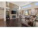Open living area with a large stone fireplace and high ceilings at 7670 Frittata Ave, Las Vegas, NV 89113