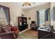 Bright home office with built-in shelving and hardwood floors at 7670 Frittata Ave, Las Vegas, NV 89113