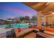 Relaxing patio with seating area overlooking the pool and landscape at 7670 Frittata Ave, Las Vegas, NV 89113