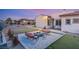 Cozy patio with fire pit and seating area, ideal for outdoor gatherings at 7670 Frittata Ave, Las Vegas, NV 89113