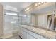 Elegant bathroom with granite countertops and shower at 7745 Rosebark Cliffs St, North Las Vegas, NV 89084