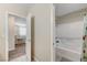 Shared bathroom with tub and adjacent bedroom view at 7745 Rosebark Cliffs St, North Las Vegas, NV 89084