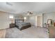 Bright bedroom featuring a king-size bed and ample space at 7745 Rosebark Cliffs St, North Las Vegas, NV 89084