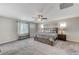 Spacious bedroom with carpeted floor and ceiling fan at 7745 Rosebark Cliffs St, North Las Vegas, NV 89084