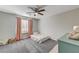 Small bedroom with a twin bed and soft decor at 7745 Rosebark Cliffs St, North Las Vegas, NV 89084