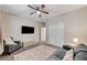 Relaxing bedroom with gray couch and carpet flooring at 7745 Rosebark Cliffs St, North Las Vegas, NV 89084