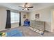 bedroom with a dresser and space-themed decor at 7745 Rosebark Cliffs St, North Las Vegas, NV 89084