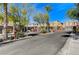Gated community entrance with landscaping and street view at 7745 Rosebark Cliffs St, North Las Vegas, NV 89084