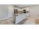 Open concept kitchen with island and stainless steel appliances at 7745 Rosebark Cliffs St, North Las Vegas, NV 89084