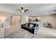 Open concept kitchen and dining area with stainless steel appliances and island at 7745 Rosebark Cliffs St, North Las Vegas, NV 89084