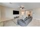 Spacious living room with tile floors and a view into the kitchen and dining area at 7745 Rosebark Cliffs St, North Las Vegas, NV 89084