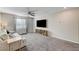 Loft with large TV, seating, and built-in shelving at 7745 Rosebark Cliffs St, North Las Vegas, NV 89084