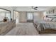 Main bedroom with large bed, dresser, and barn door at 7745 Rosebark Cliffs St, North Las Vegas, NV 89084
