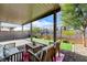 Covered patio with seating area and view of backyard at 7745 Rosebark Cliffs St, North Las Vegas, NV 89084