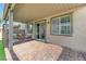 Covered patio with brick pavers and access to backyard at 7745 Rosebark Cliffs St, North Las Vegas, NV 89084