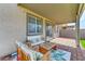 Covered patio with seating area and view of backyard at 7745 Rosebark Cliffs St, North Las Vegas, NV 89084