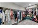 Large walk-in closet with ample hanging and shelving space at 7745 Rosebark Cliffs St, North Las Vegas, NV 89084