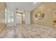 Living room featuring tile floors, high ceilings, and a painted mural at 8482 Lambert Dr, Las Vegas, NV 89147