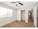 Bedroom with ceiling fan, window, and mirrored closet at 950 Clipper Dr, Henderson, NV 89015